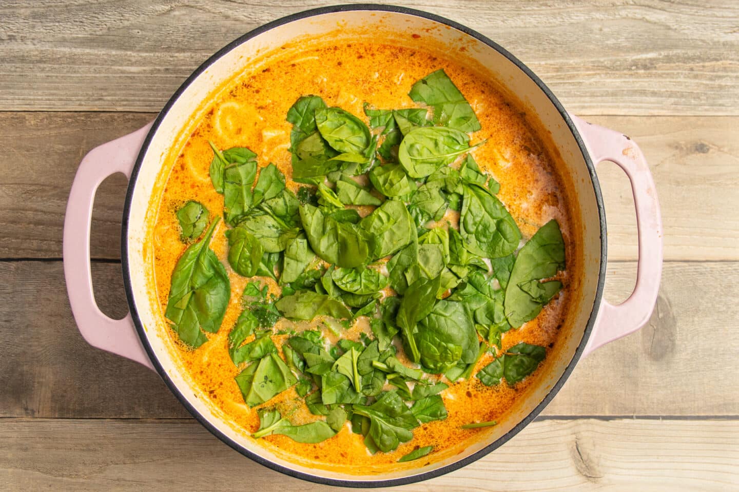 This is a picture of the pot with fresh spinach added.