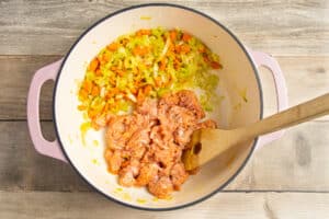 This is a picture of the pot with sausage added to the carrots and leeks.